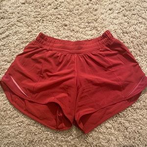 Lululemon hotty hot shorts 4” size 4 in a rusty red color.